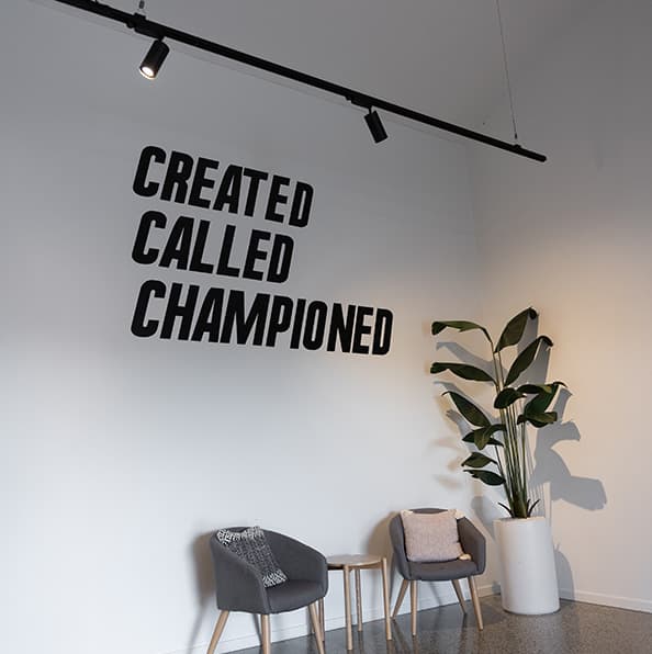 "Created, Called, Championed" wall lettering in the City on a Hill Church foyer